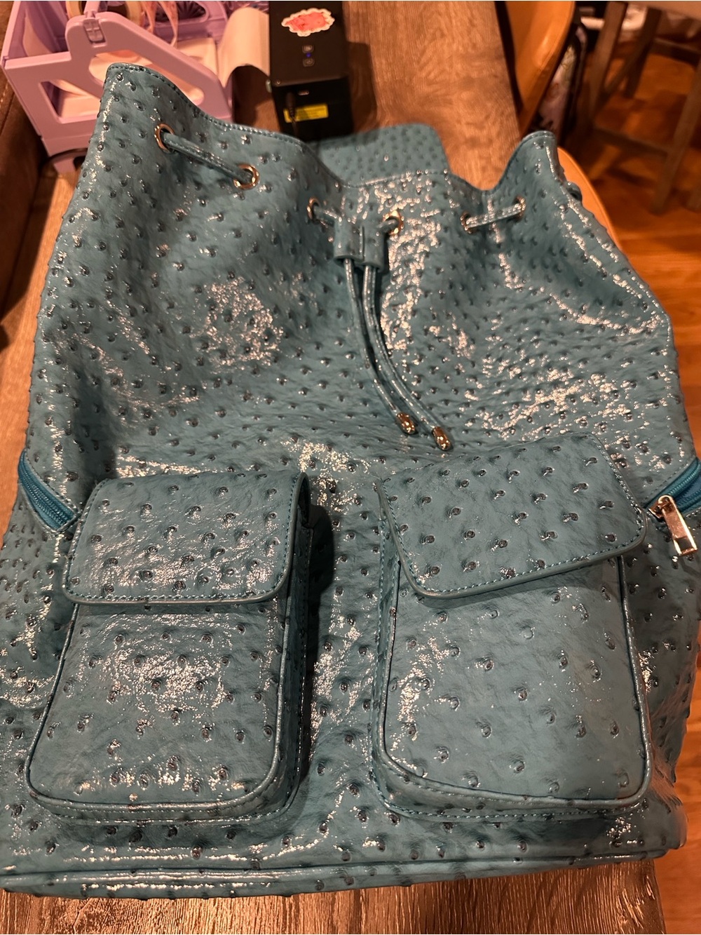 Teal Faux-Ostrich Drawstring Backpack with Front Pockets